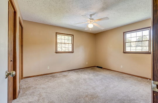 bedroom, closet, carpet, windows, wood trim, ceiling fan