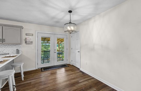 dining area, door to back deck, luxury vinyl flooring