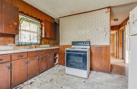 kitchen, fixer upper, cabinets, sink, refrigerator, oven/range, vinyl flooring