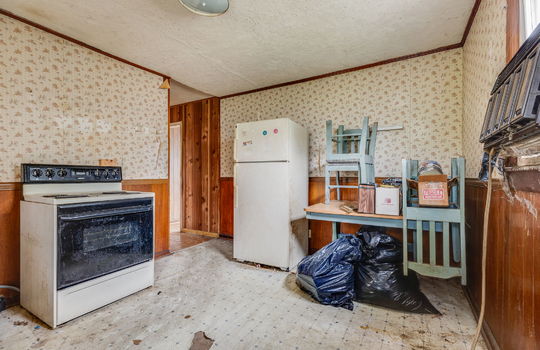 kitchen, vinyl flooring, fixer upper, paneling walls, stove, refrigerator