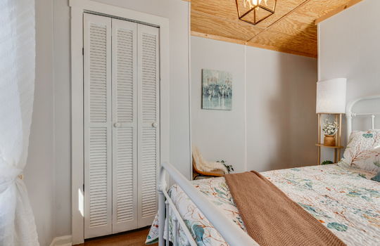 bedroom, luxury vinyl flooring, closet, beadboard ceiling
