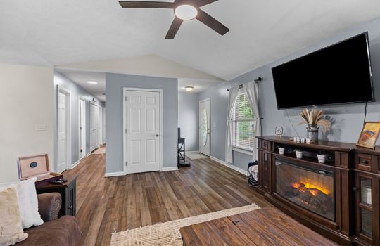 living room, front door, entry way, windows, hallway, door to lower level