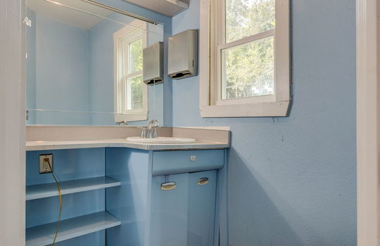 half bath, toilet, sink, window, built in shelving