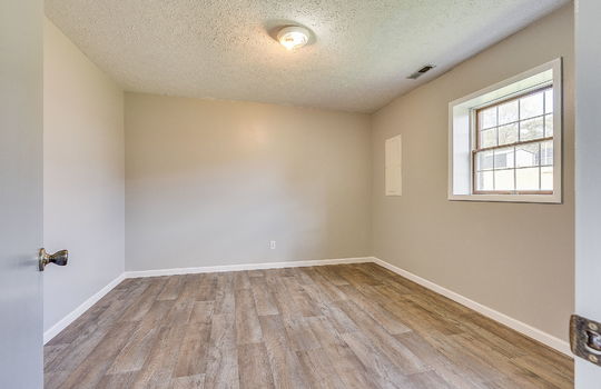 lower level bonus room/bedroom/ window, laminate flooring