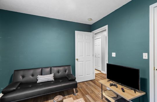 bedroom, closet, laminate flooring, door to hallway