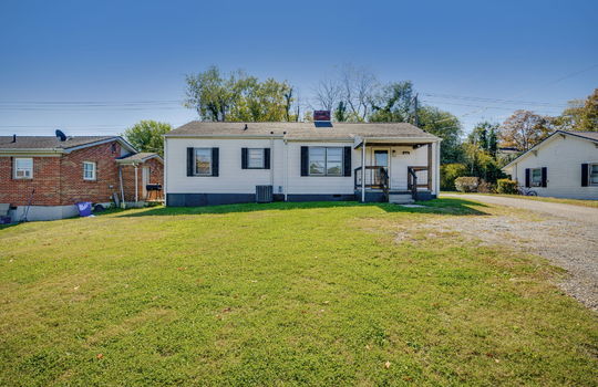 ranch style home, front yard, front porch, front door, gravel driveway