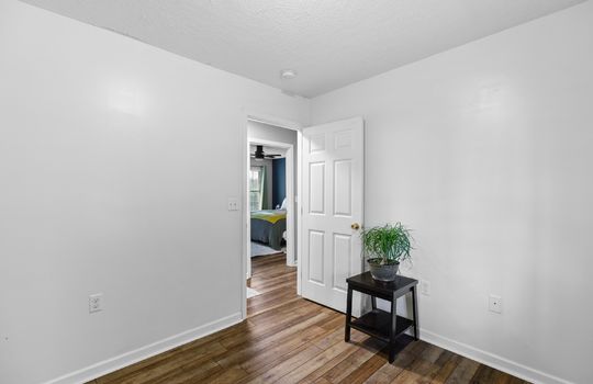 bedroom, laminate flooring, door to hallway