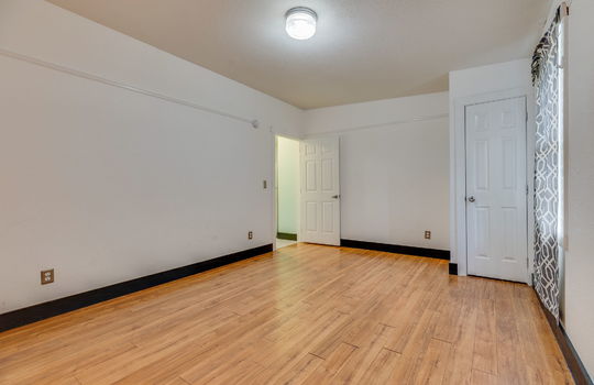 bedroom, closet, laminate flooring, doorway