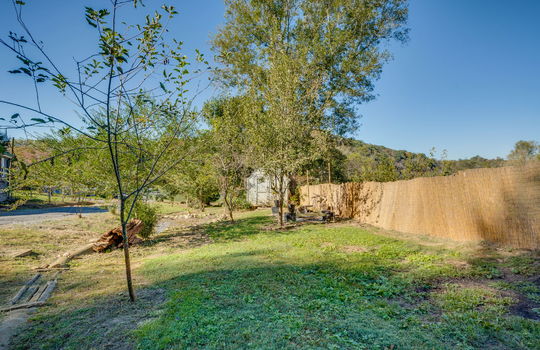 landscaping, storage shed, fencing