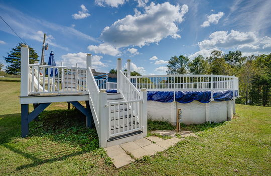 Above ground pool, gated pool deck, back yard, trees
