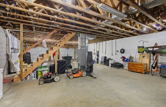 basement, concrete flooring, stairs to main level, unfinished basement