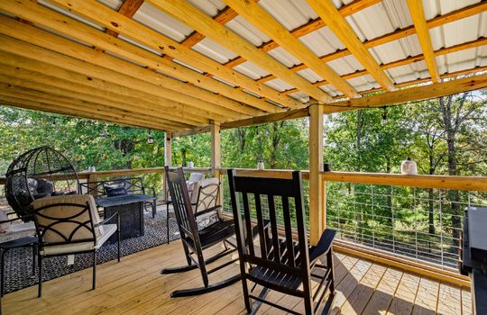 covered back deck, wood deck, trees