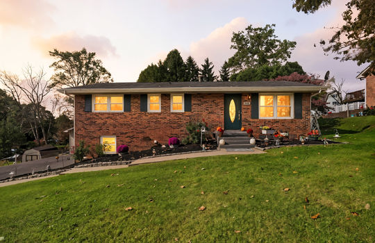 twilight photo, brick ranch, brick exterior, sidewalk, front door, front steps, landscaping, front yard, trees