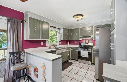 kitchen, tile flooring, cabinets, countertops, stainless appliances, sink, dishwasher, oven/range, refrigerator