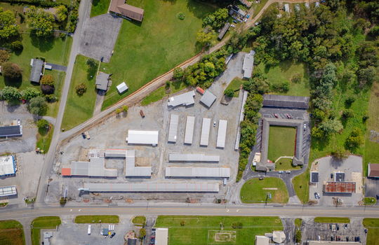 aerial photo of property surrounding homes and businesses