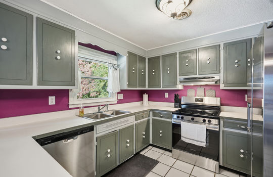 kitchen, tile flooring, cabinets, countertops, stainless appliances, sink, dishwasher, oven/range, refrigerator