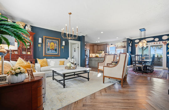 living room, open floorplan, dining area, kitchen, luxury vinyl flooring, chandelier