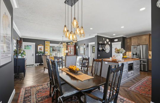 dining area view toward kitchen and living room, luxury vinyl flooring