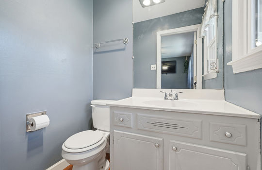 primary bedroom half bath, toilet, sink