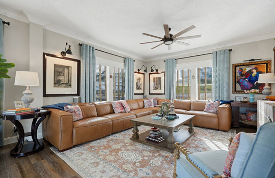 family room, sitting area, ceiling fan, luxury vinyl flooring, accent lighting, windows