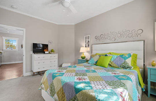 bedroom, carpet, ceiling fan, door to hallway