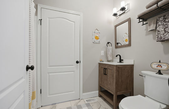 bathroom, shower/tub, sink, toilet, tile flooring