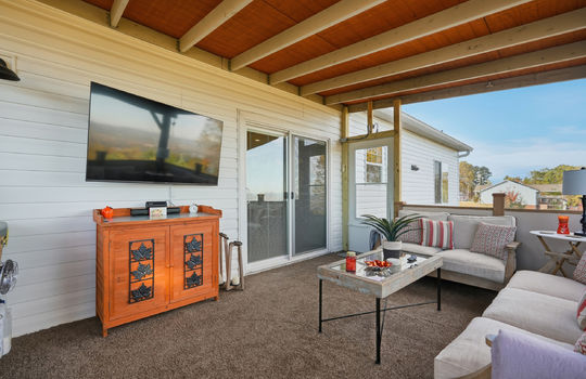 back deck, vinyl siding, covered back deck, door to interior