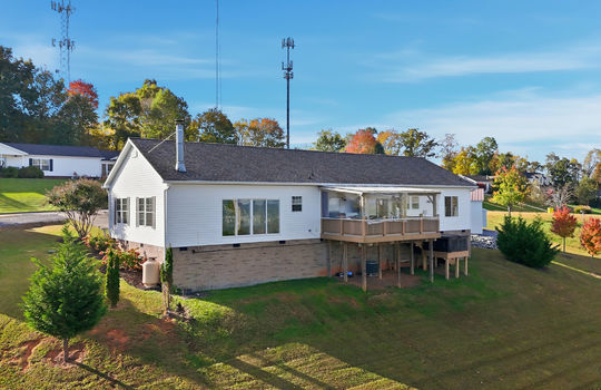 back of home, modular home, back deck, hot tub, detached garage
