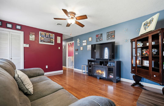 living room, closet, hardwood flooring, ceiling fan, hallway
