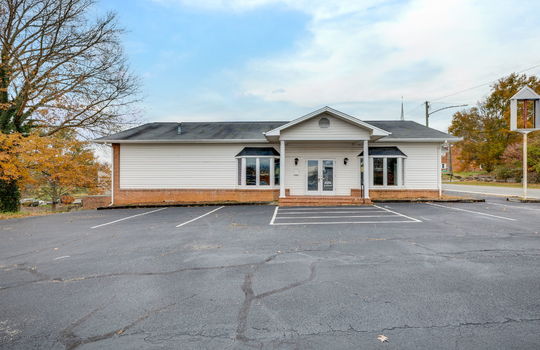 Commercial Building For Lease, Brick, Vinyl Siding, Parking lot, Front Entry, Covered Front Entry, Double Door Entry, Signage, Road