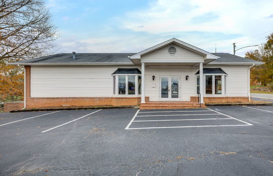 Commercial Building For Lease, Brick, Vinyl Siding, Parking lot, Front Entry, Covered Front Entry, Double Door Entry, Road