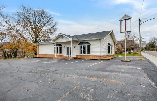 Commercial Building For Lease, Brick, Vinyl Siding, Parking lot, Front Entry, Covered Front Entry, Double Door Entry, Signage, Road