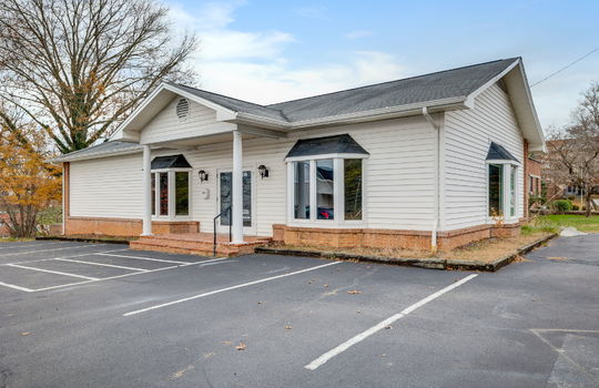 Commercial Building For Lease, Brick, Vinyl Siding, Parking lot, Front Entry, Covered Front Entry, Double Door Entry, Signage, Road