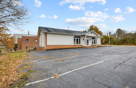 Commercial Building For Lease, Brick, Vinyl Siding, Parking lot, Front Entry, Covered Front Entry, Double Door Entry, Signage, Road