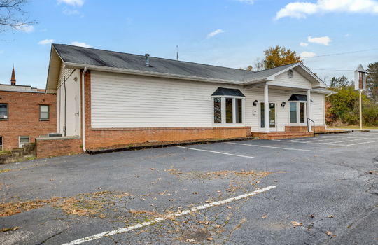 Commercial Building For Lease, Brick, Vinyl Siding, Parking lot, Front Entry, Covered Front Entry, Double Door Entry, Signage, Road