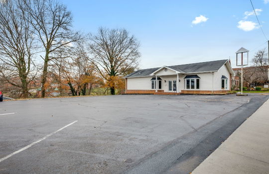 Commercial Building For Lease, Brick, Vinyl Siding, Parking lot, Front Entry, Covered Front Entry, Double Door Entry, Signage, Road