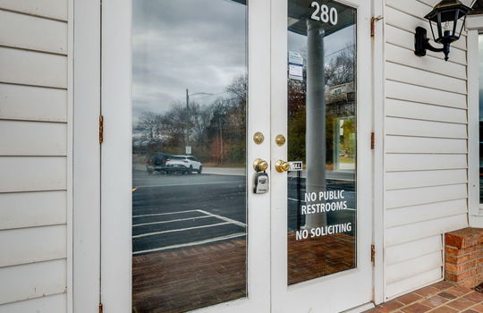 commercial building for lease, double door front entry, vinyl siding