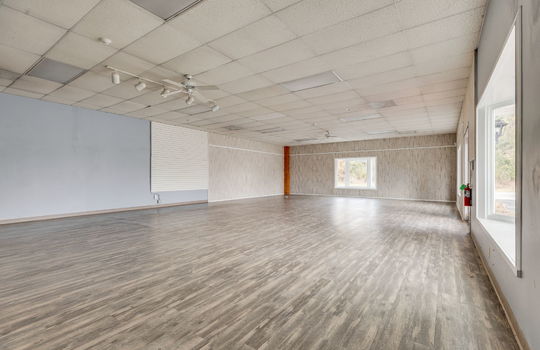 interior commercial space, commercial building for lease, vinyl flooring, ceiling tiles, fluorescent lighting