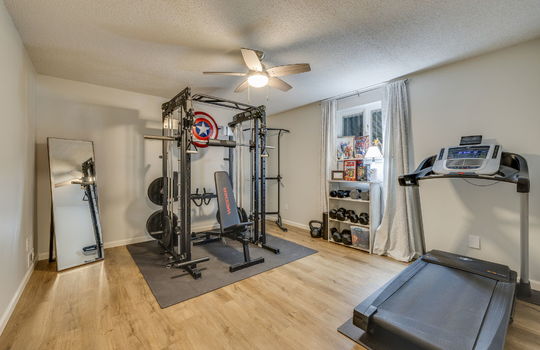 flex room/bedroom, ceiling fan, luxury vinyl flooring, window