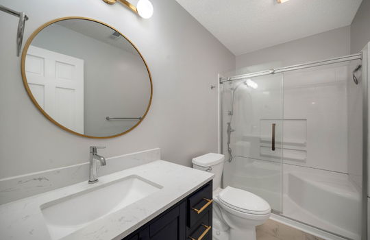 bathroom, tile flooring, shower, toilet, sink