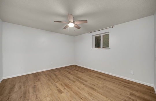 bedroom, luxury vinyl flooring, ceiling fan, window