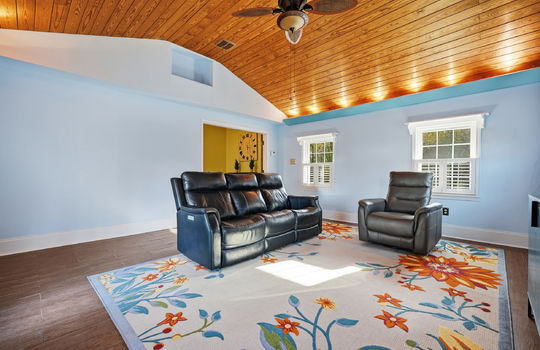sunroom, tile flooring, tongue and groove wood ceiling, ceiling fan, windows view toward dining room