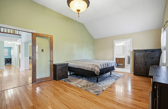 bedroom, glass door, hardwood flooring, windows, ensuite bath