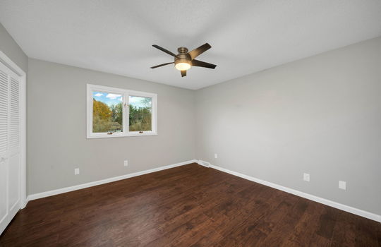 bedroom, closet, luxury vinyl flooring ceiling fan