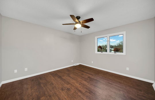 bedroom, window, ceiling fan, luxury vinyl flooring