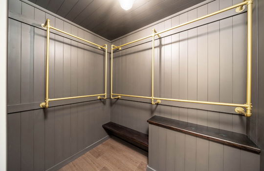 closet, metal pipe shelving, luxury vinyl flooring