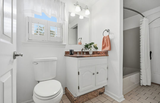 upper level bathroom, toilet, shower, sink, granite countertops, tile flooring