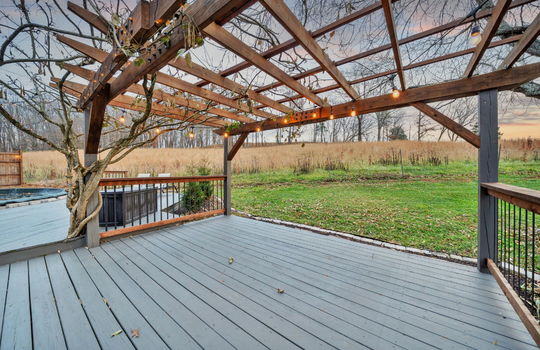 pergola, view of field, back deck