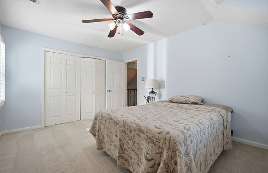 upper level bedroom, ceiling fan, closet, doorway, carpet