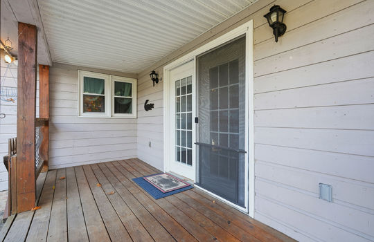 back deck, wood siding, wood deck, double door